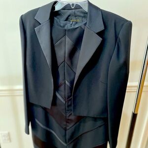 Black sheath dress with bandage pattern and matching jacket. Size 12 knee length